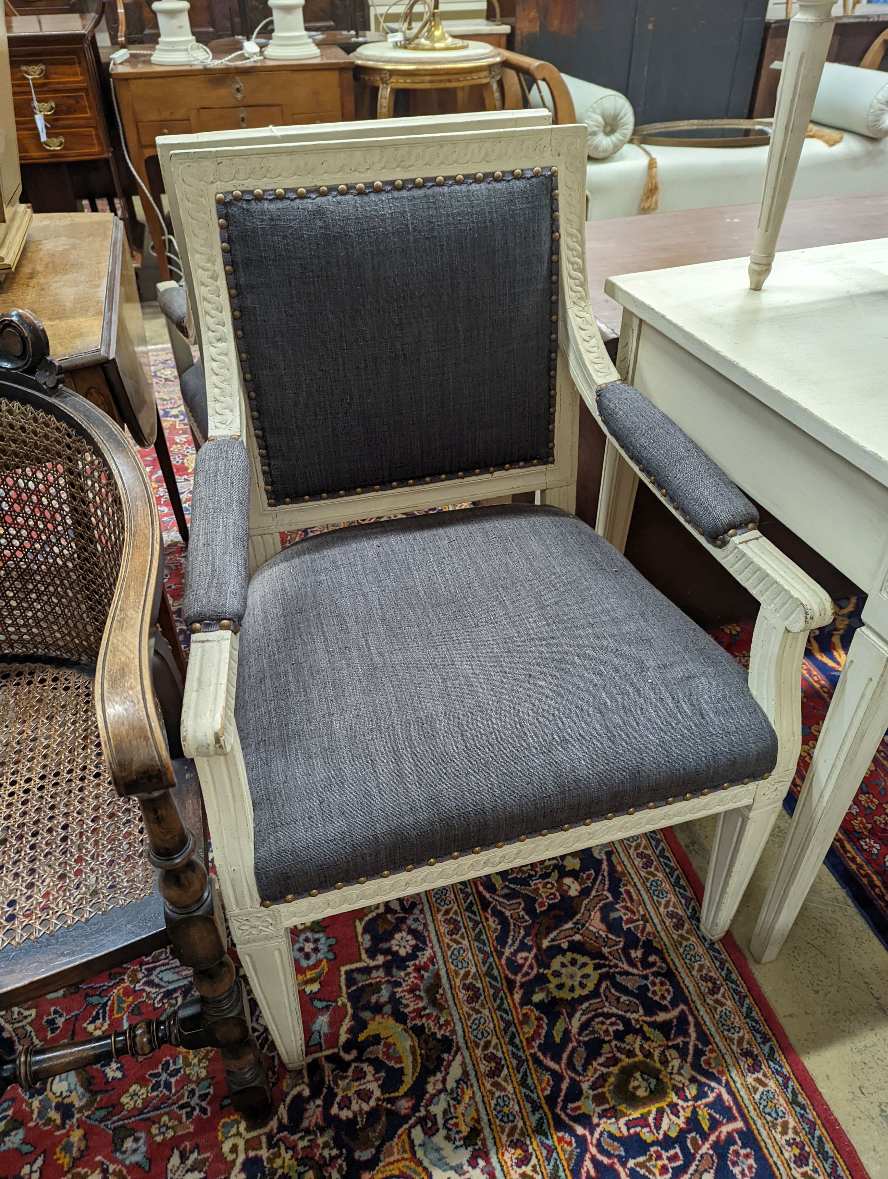 A pair of painted upholstered open armchairs, width 60cm, depth 50cm, height 91cm